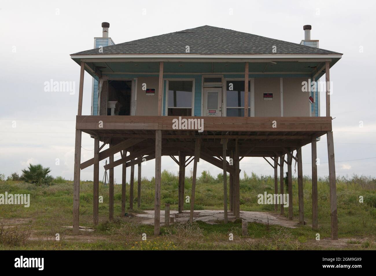 House on stilts damaged by Hurricane Ike in Long Beach, Johnson Bayou, LA. FEMA now requires elevated  construction. Stock Photo
