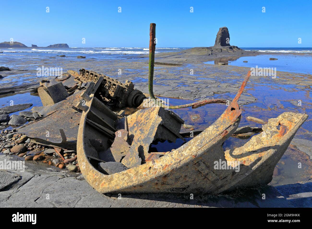 Wreck of the Admiral Von Tromp and Black Nab sea stack in Saltwick Bay near Whitby, North Yorkshire, England, UK. Stock Photo