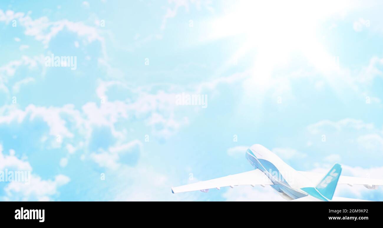 The travel by plane flies in the sky above the clouds Stock Photo - Alamy