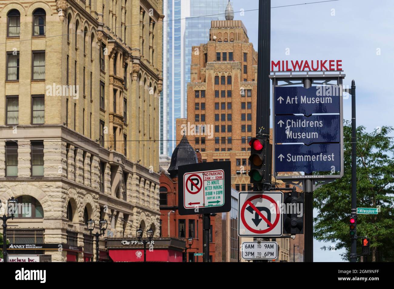 The intersection of Milwaukee S and Wisconsin Ave in downtown Milwaukee, Wisconsin offers a view of the Pfister Hotel and Wisconsin Gas Building Stock Photo