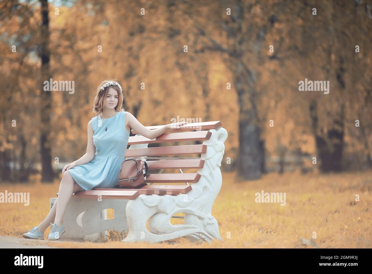 Young girl on a walk in the autumn park Stock Photo - Alamy
