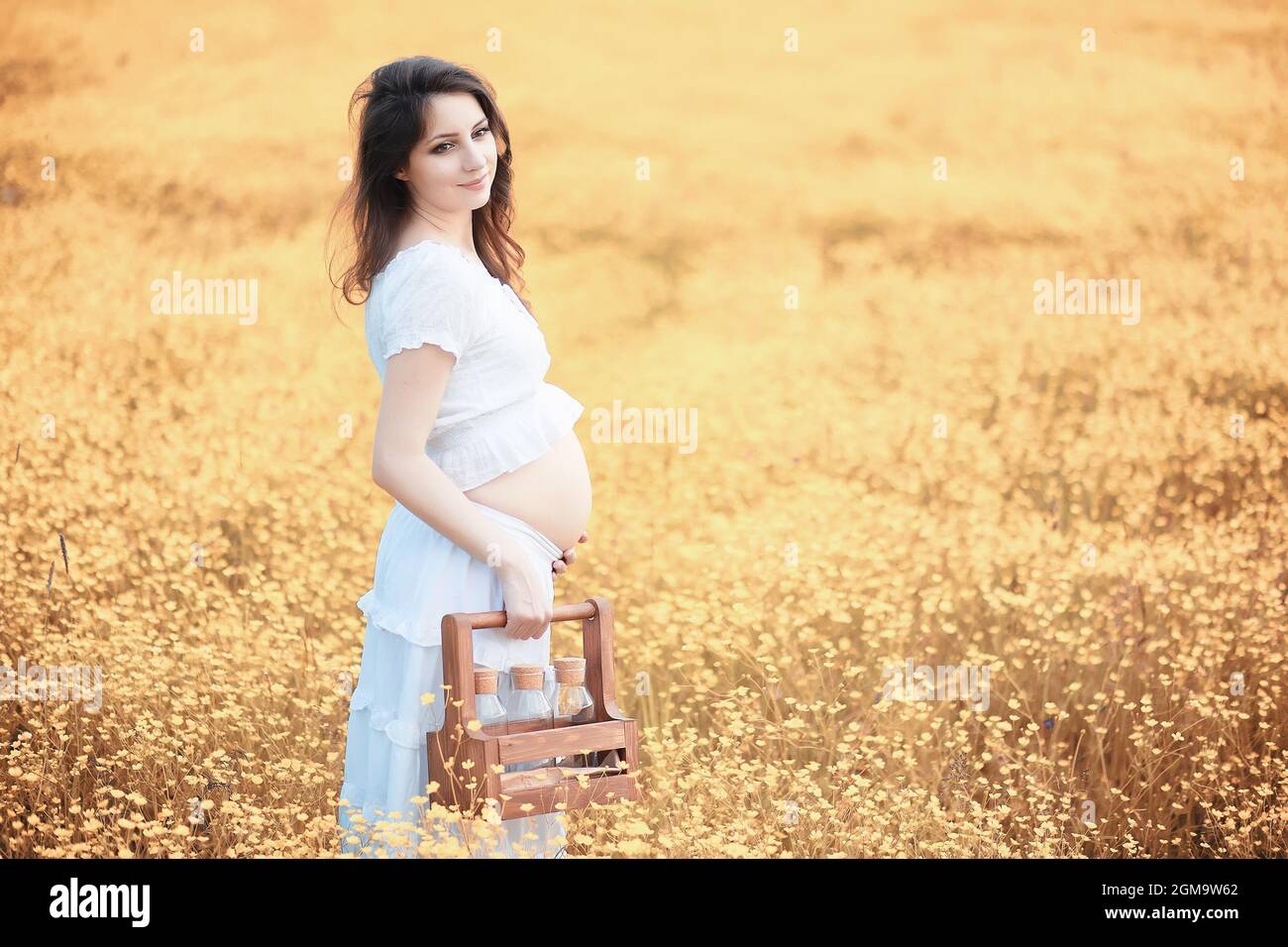 Pregnant woman in nature for a walk in the autumn Stock Photo - Alamy