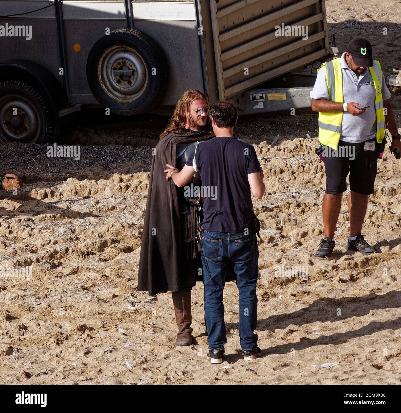 Cast and crew on Location film set at Holywell Bay Cornwall, set of House of Dragon exclusive Stock Photo