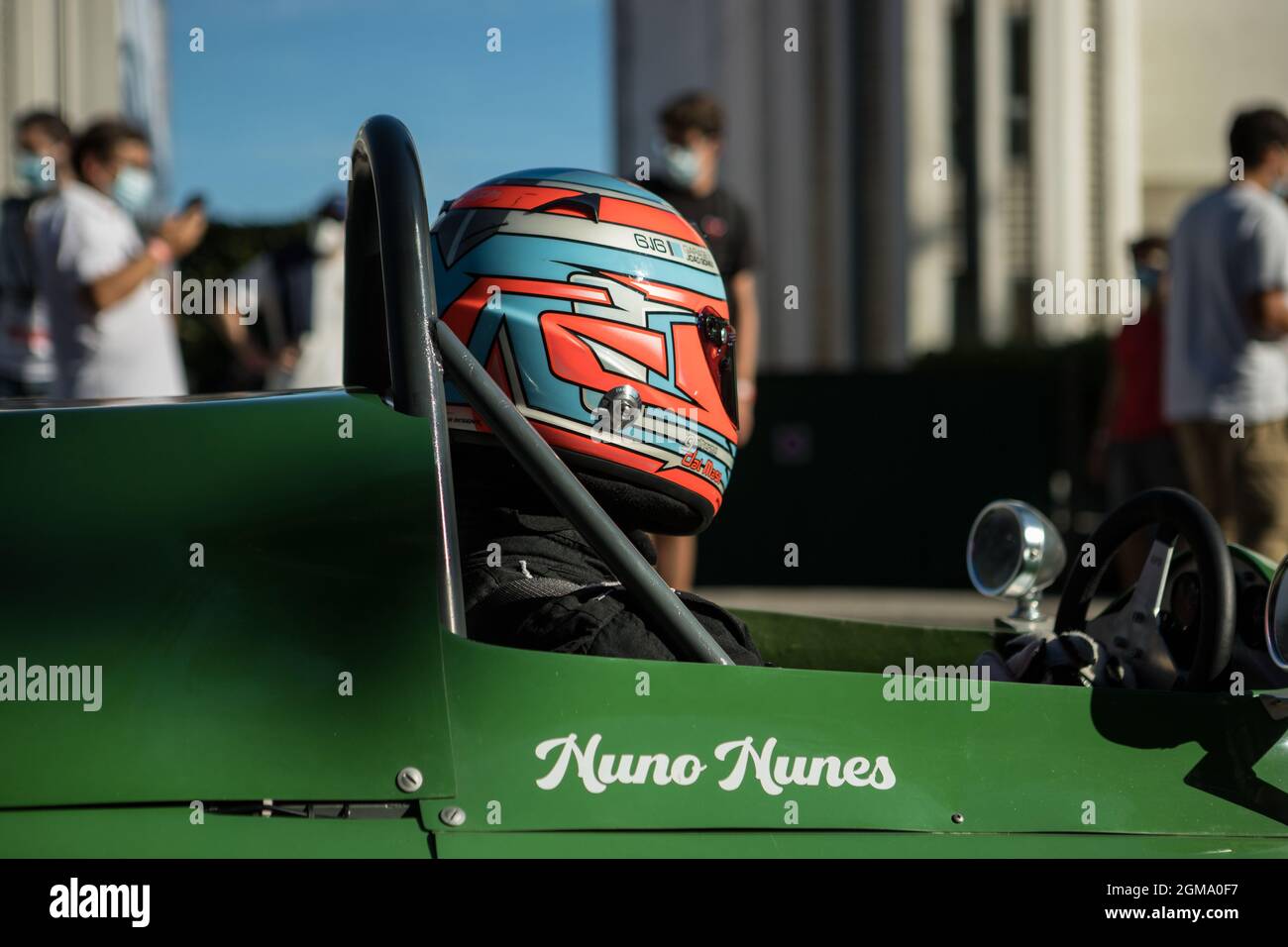 Caramulo, Portugal - 04 September 2021: Portuguese driver in his green racing car in Caramulo Motorfestival 2021 Stock Photo