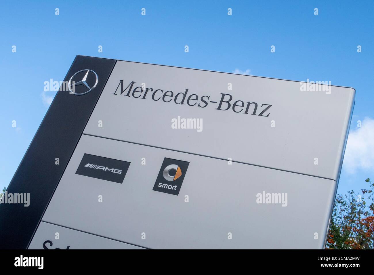 Mercedes Benz, AMG and Smart logo and sign outside car dealer showroom, Exeter Stock Photo