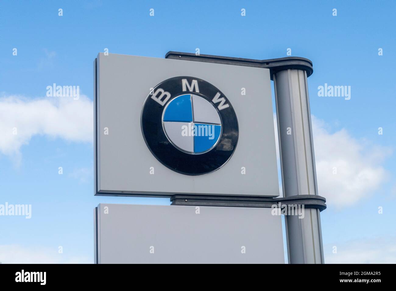 BMW car logo and sign outside car dealer showroom, Exeter Stock Photo