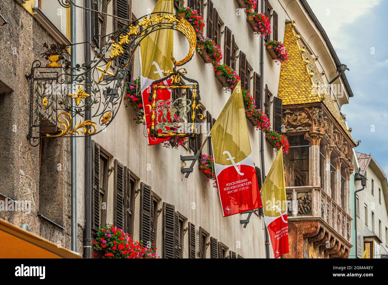 The Golden Roof (Goldenes Dachl) is the symbol of Innsbruck, a loggia covered with golden copper tiles at the end of Via Maria-Theresien-Strasse. Stock Photo