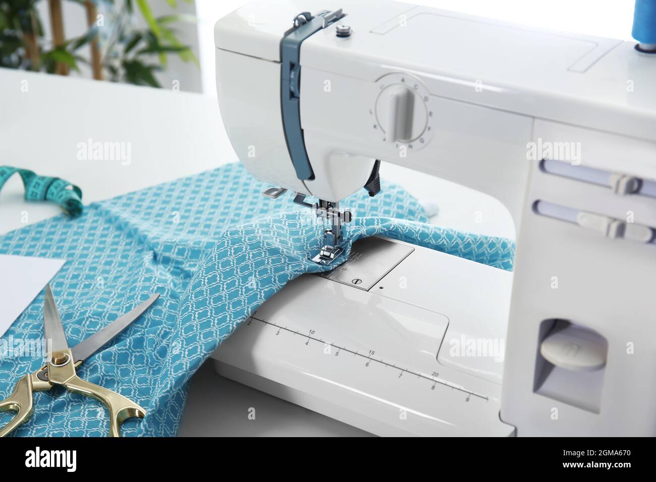 Sewing machine with fabric on table, closeup Stock Photo Alamy