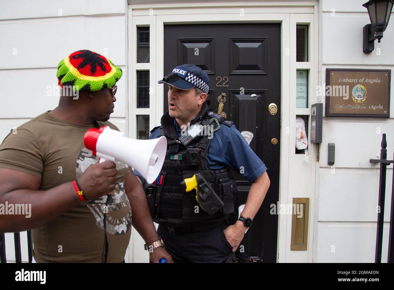 London, UK. 17th Sep, 2021. A police officer seen talking to a protester outside the Embassy of Angola during the demonstration.Activists held a protest against the rise of human rights Abuse, pedophilia and corruption in Angola. Credit: SOPA Images Limited/Alamy Live News Stock Photo
