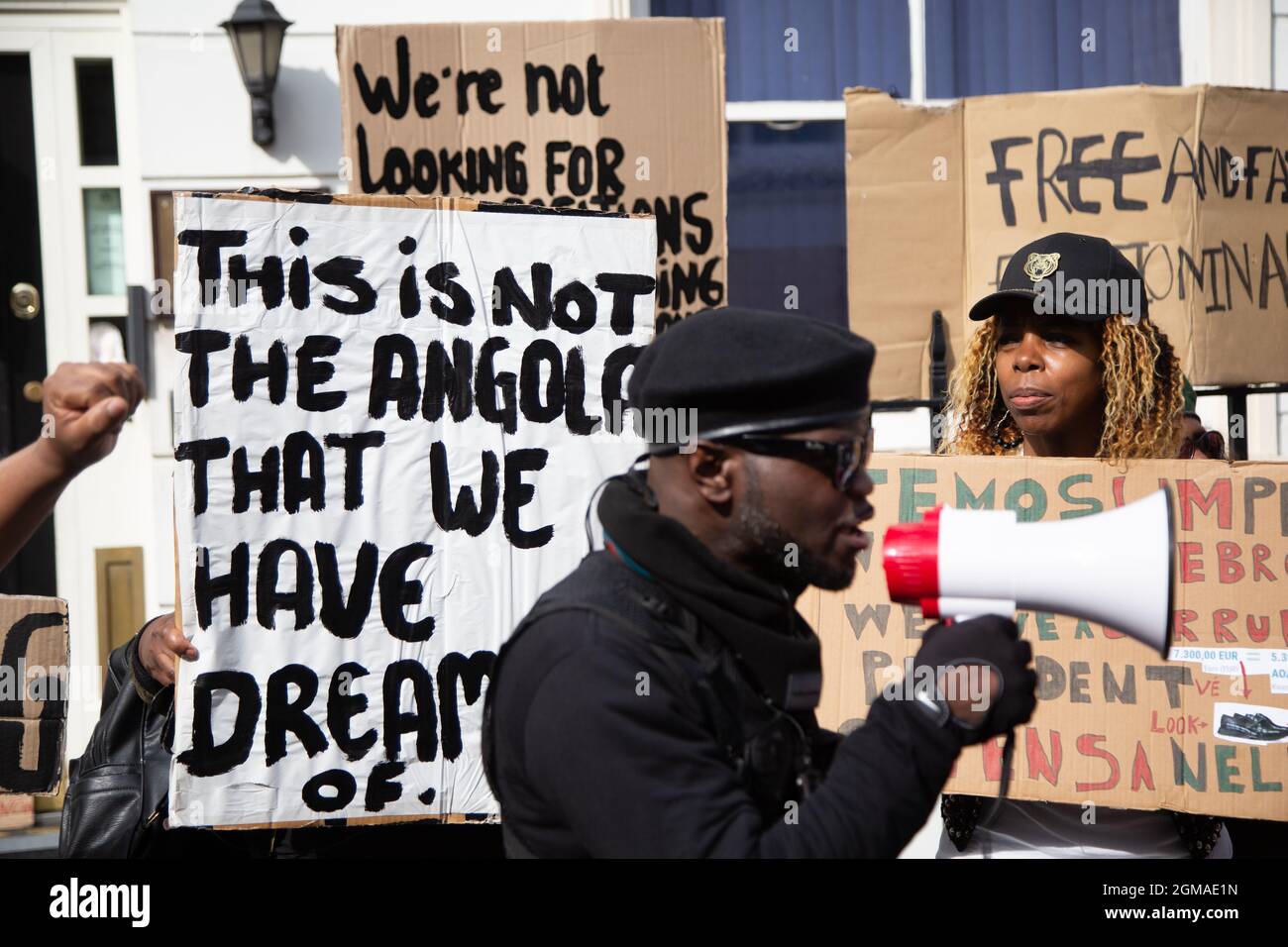 London, UK. 17th Sep, 2021. Alfa Kuabo human rights activist from Angola chants slogans on a megaphone outside the Embassy of Angola during the demonstration.Activists held a protest against the rise of human rights Abuse, pedophilia and corruption in Angola. Credit: SOPA Images Limited/Alamy Live News Stock Photo