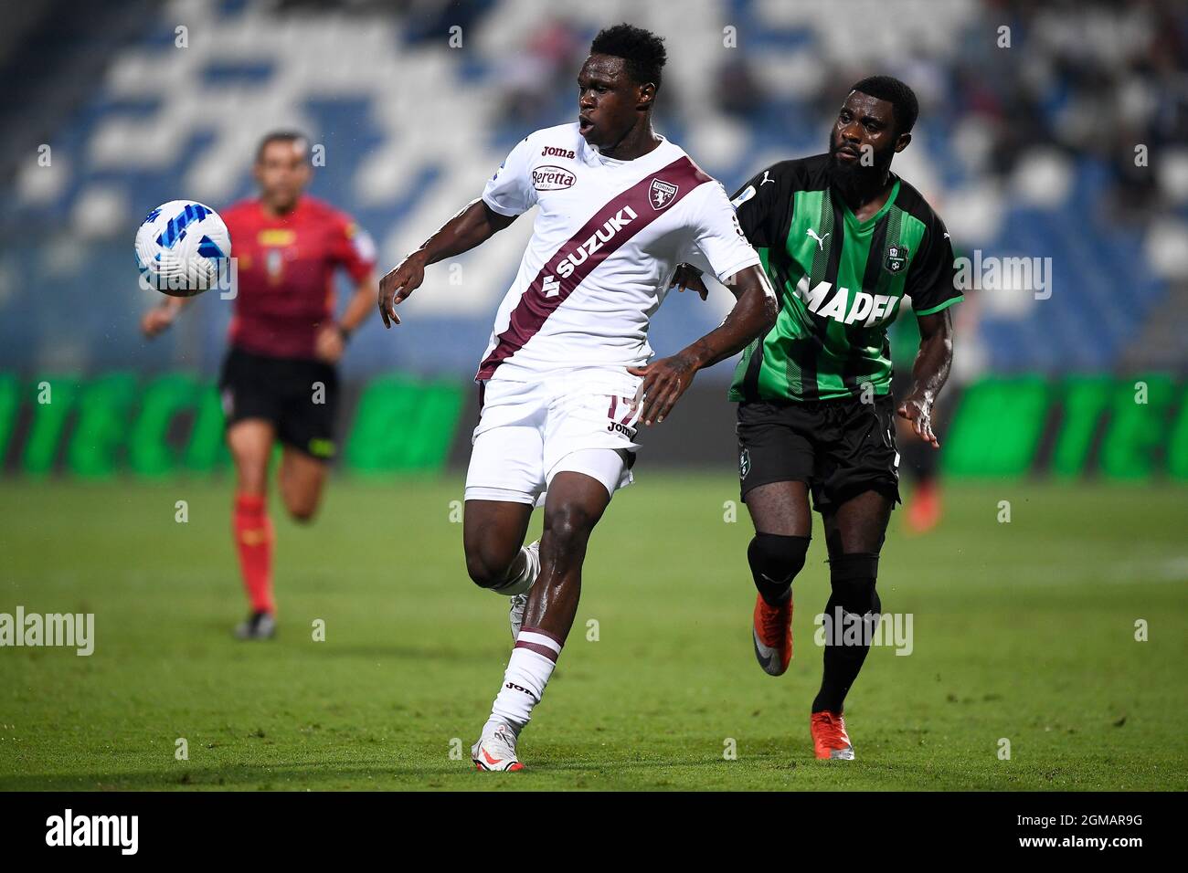Reggio Emilia, Italy. 17 September 2021. Wilfried Singo (L) of Torino FC competes for the ball with Jeremie Boga of US Sassuolo during the Serie A football match between US Sassuolo and Torino FC. Credit: Nicolò Campo/Alamy Live News Stock Photo