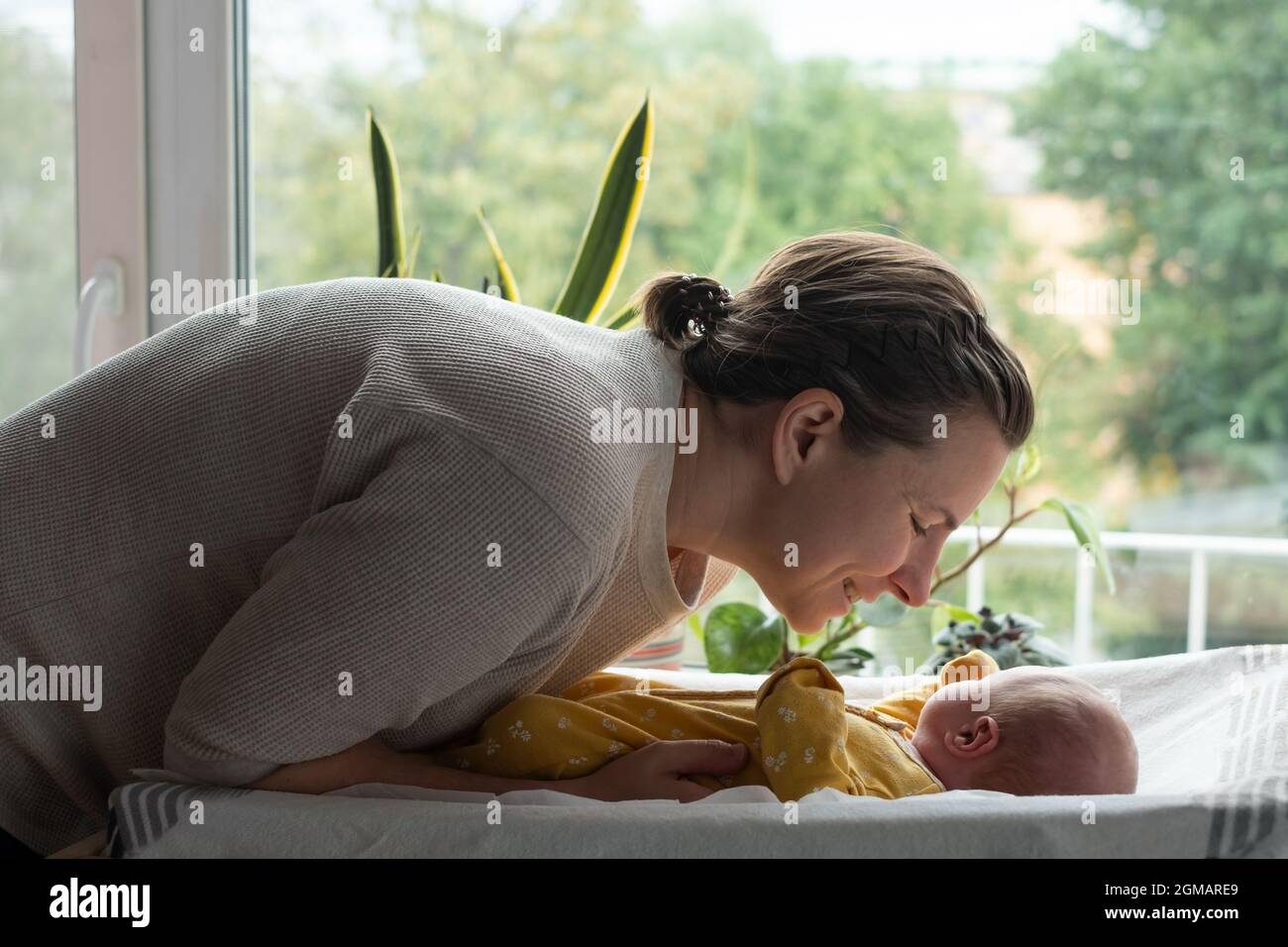 Caucasian mother changing baby girl clean cloth Stock Photo Alamy
