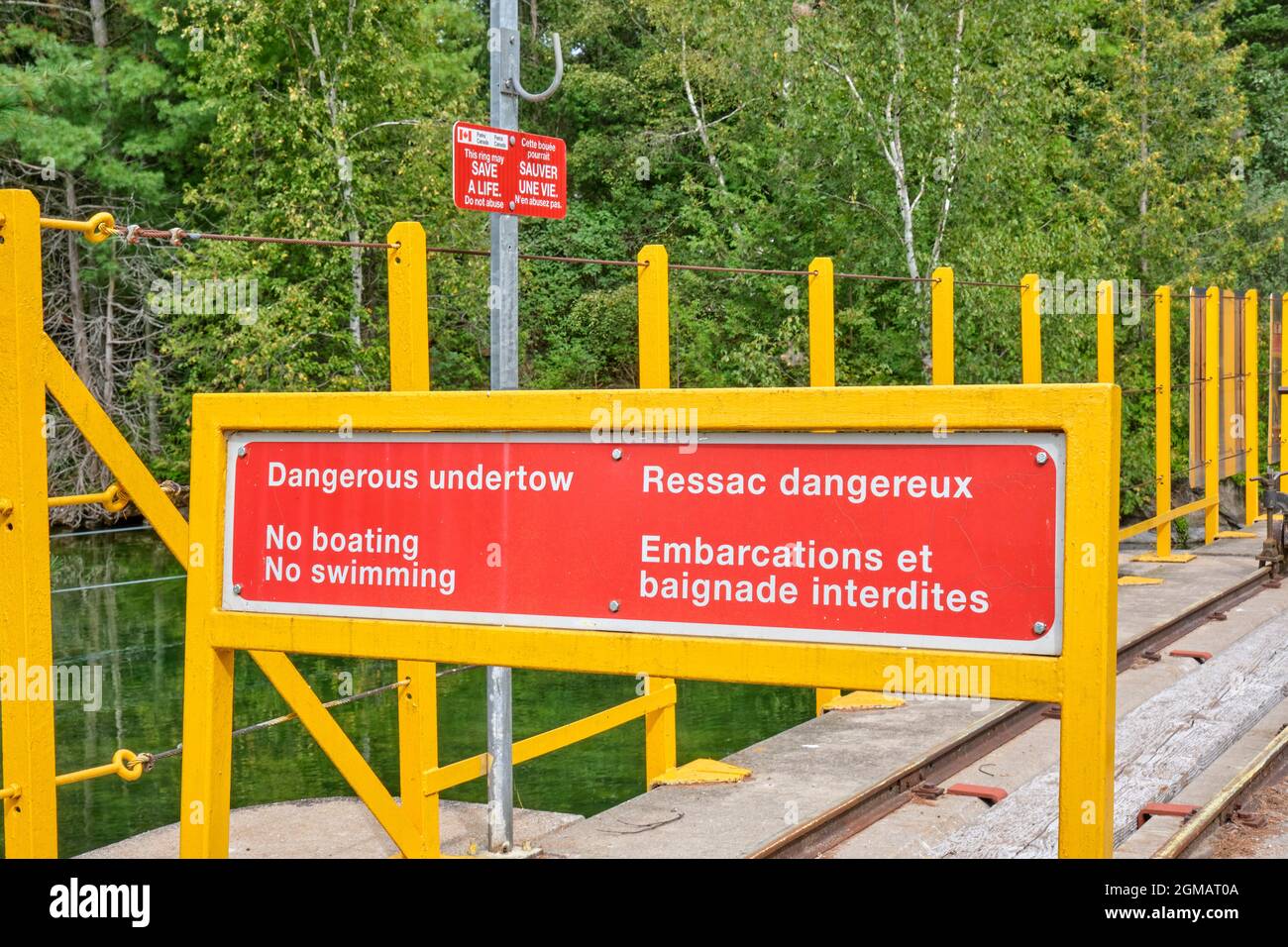 Sign advising dangerous undertows on a water control dam near washago ontario. Stock Photo