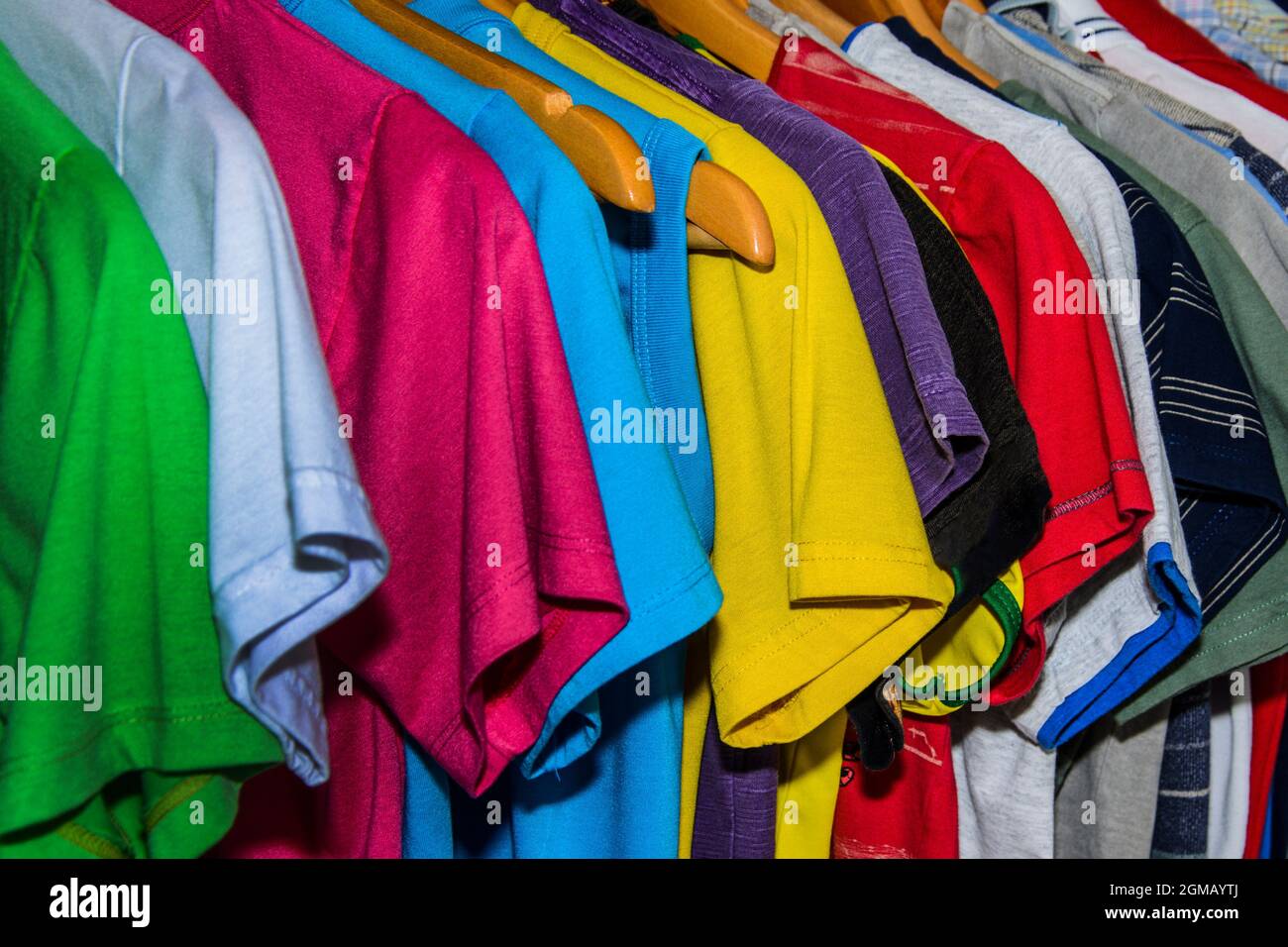 Lots of colored shirts on the hanger tidy and washed for use. Salvador Bahia Brazil. Stock Photo