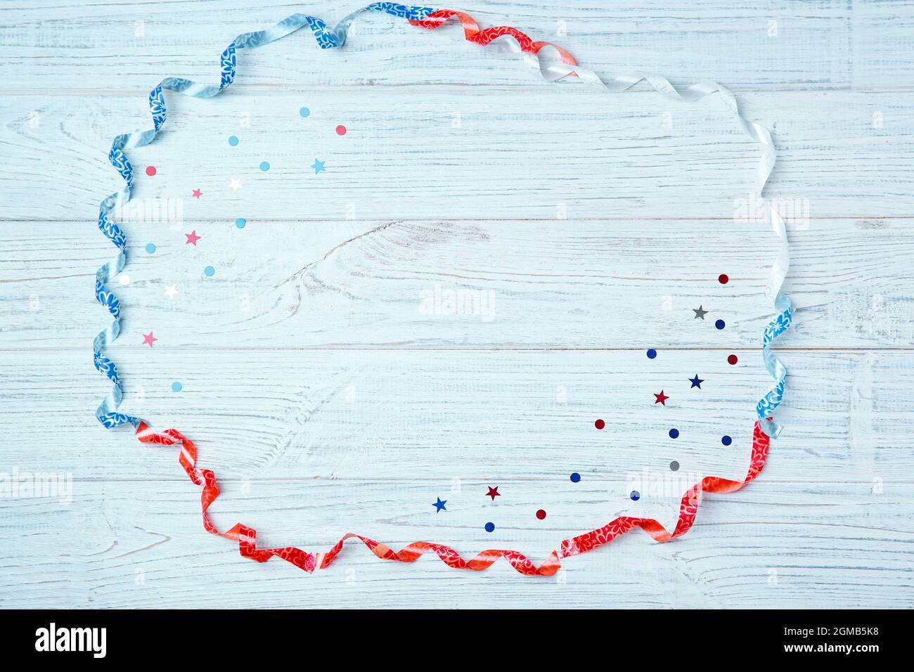 Blue, red and white streamers on light background. Patriotic American
