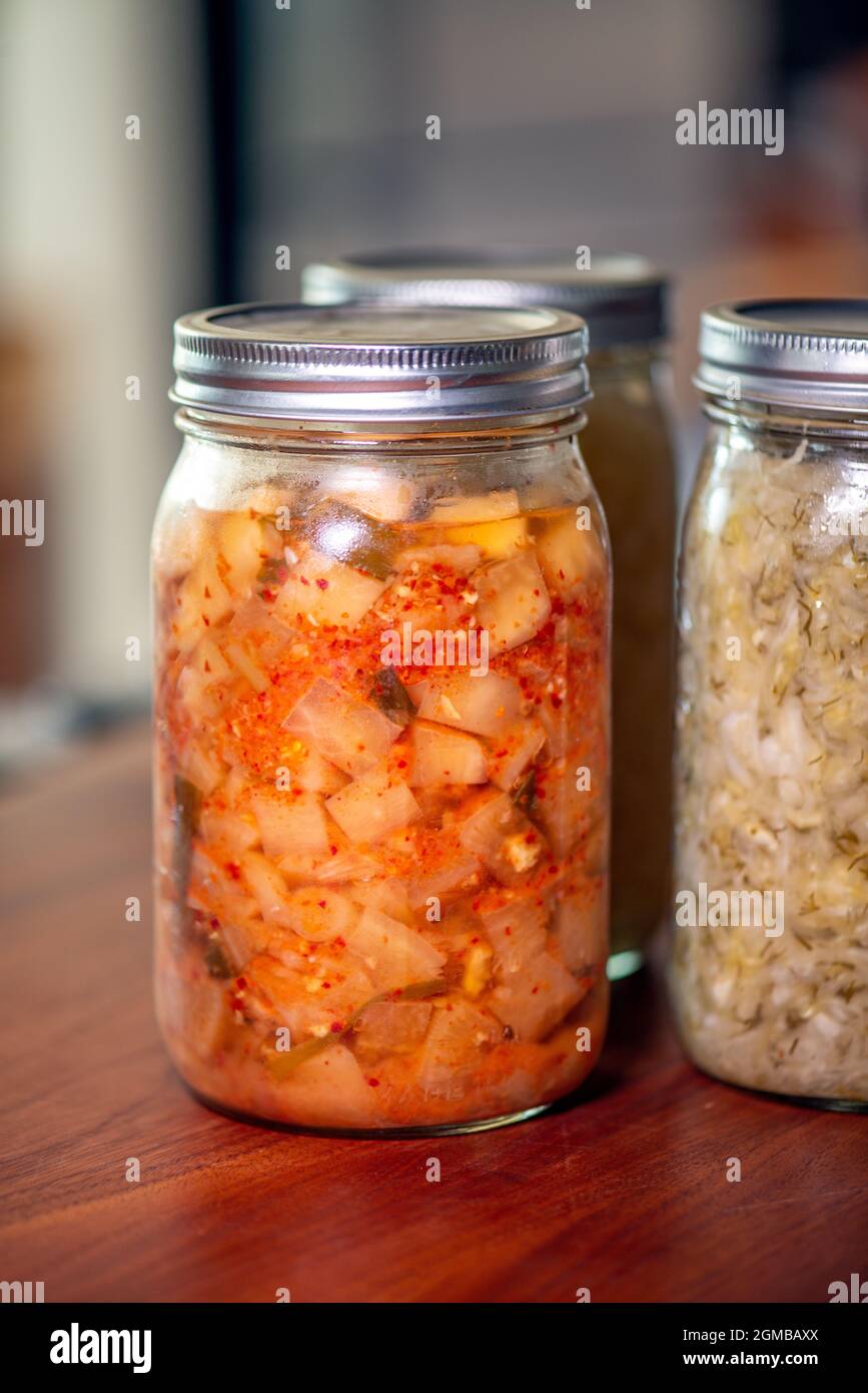 Delicious fermented kimchi and sauerkraut in mason jars Stock Photo