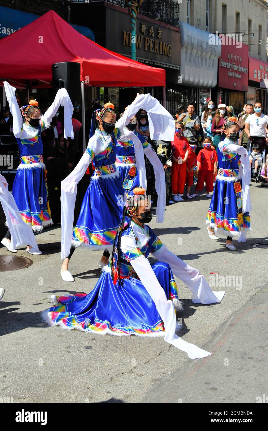 The Flying Angels Chinese Dance Company performing at the 2021 Autumn Moon Festival in Chinatown, San Francisco, California, USA; folk dance girls. Stock Photo