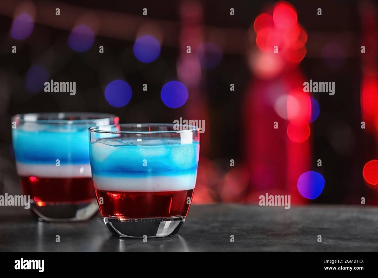 Layered patriotic drinks on table. American flag cocktails Stock Photo ...