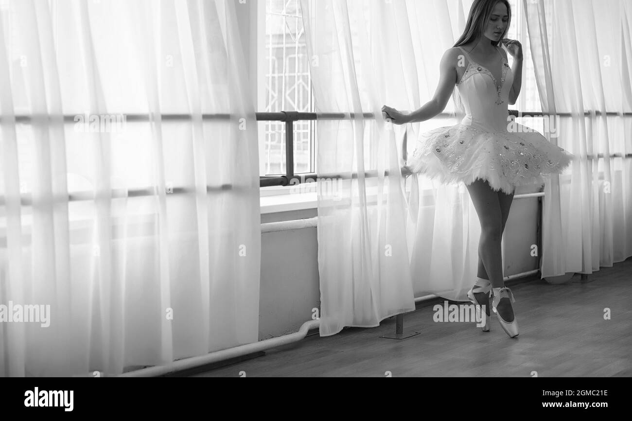 Young ballet dancer on a warmup. The ballerina is preparing to perform