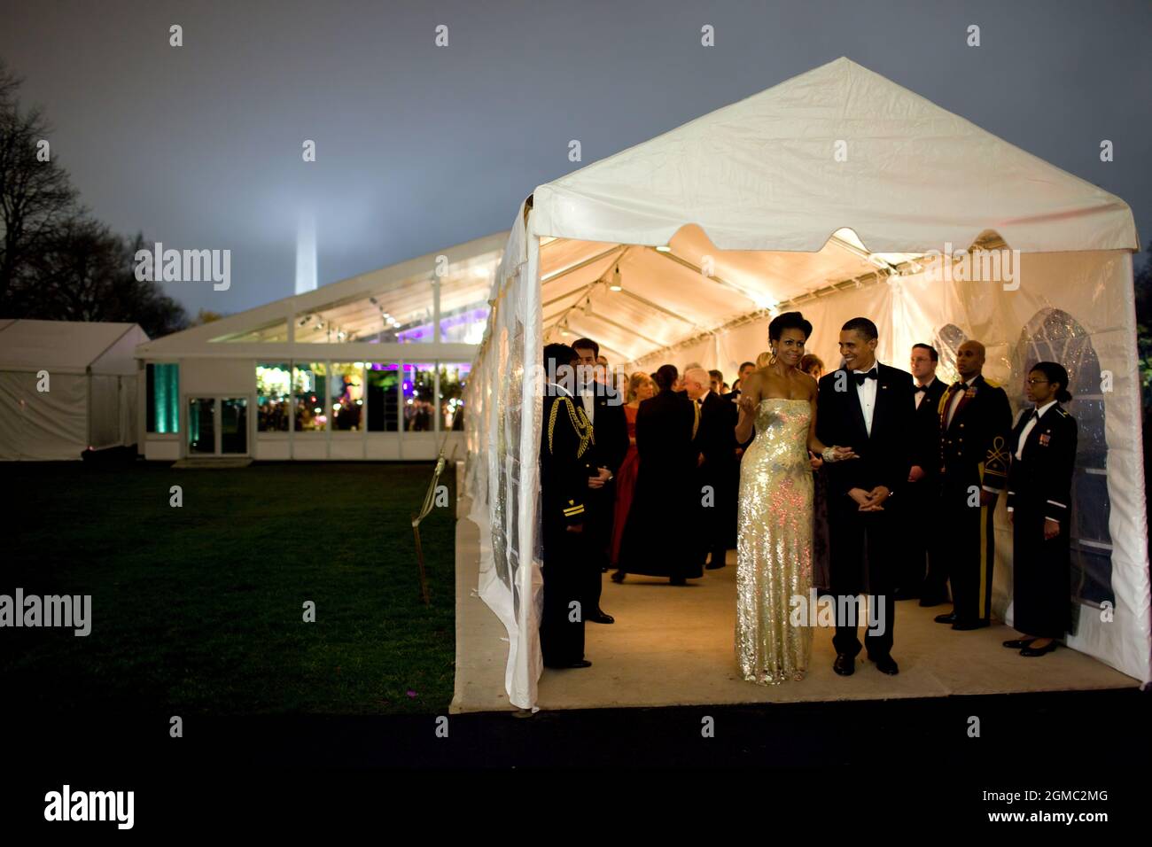 Nov. 24, 2009“The President and First Lady wait for Indian Prime Minister Singh’s motorcade to depart the White House at the conclusion of the first official state dinner for the Obama administration. The dinner was held in a tent on the South Lawn.” (Official White House photo by Pete Souza)  This official White House photograph is being made available only for publication by news organizations and/or for personal use printing by the subject(s) of the photograph. The photograph may not be manipulated in any way and may not be used in commercial or political materials, advertisements, emails, Stock Photo