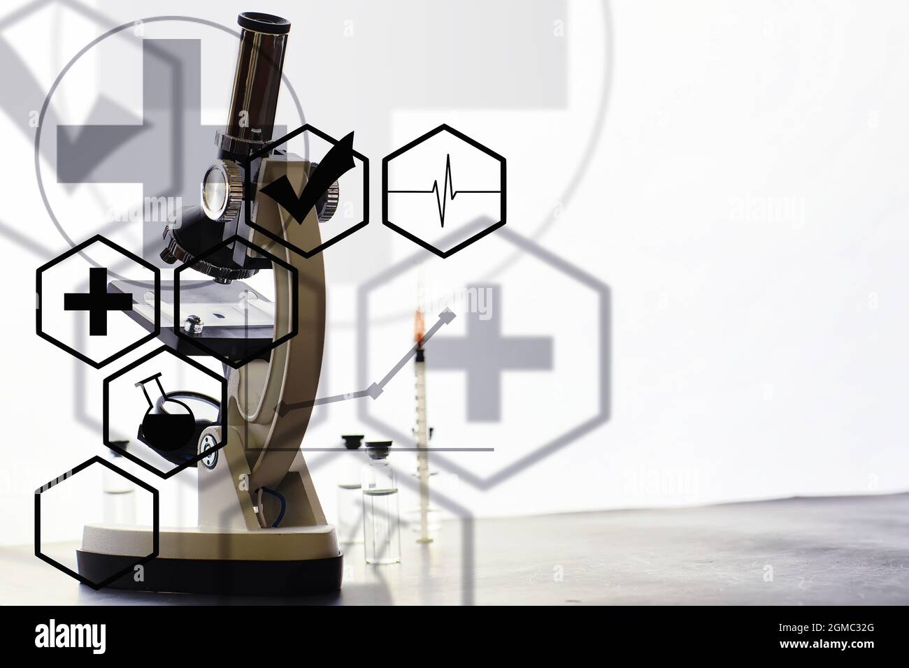 Research laboratory. Test tubes and microscope on the table on a white ...