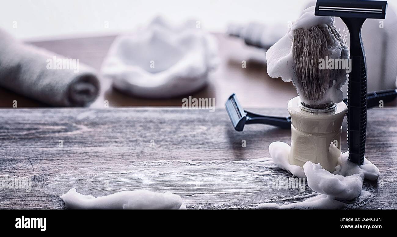 Shaving accessories on a wooden texture background. Tools. Disposable ...