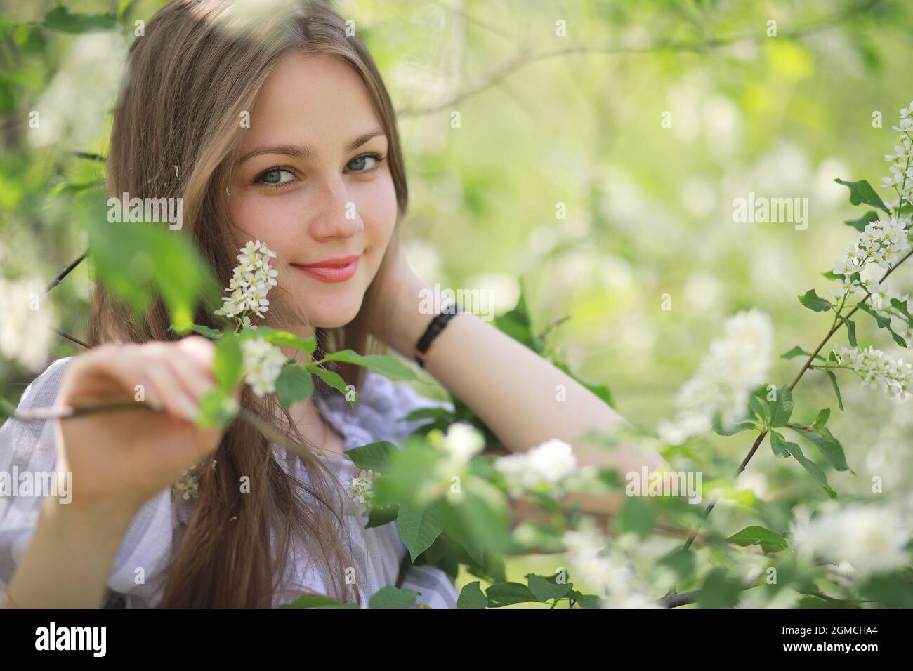 A girl in a spring green park on a walk Stock Photo - Alamy