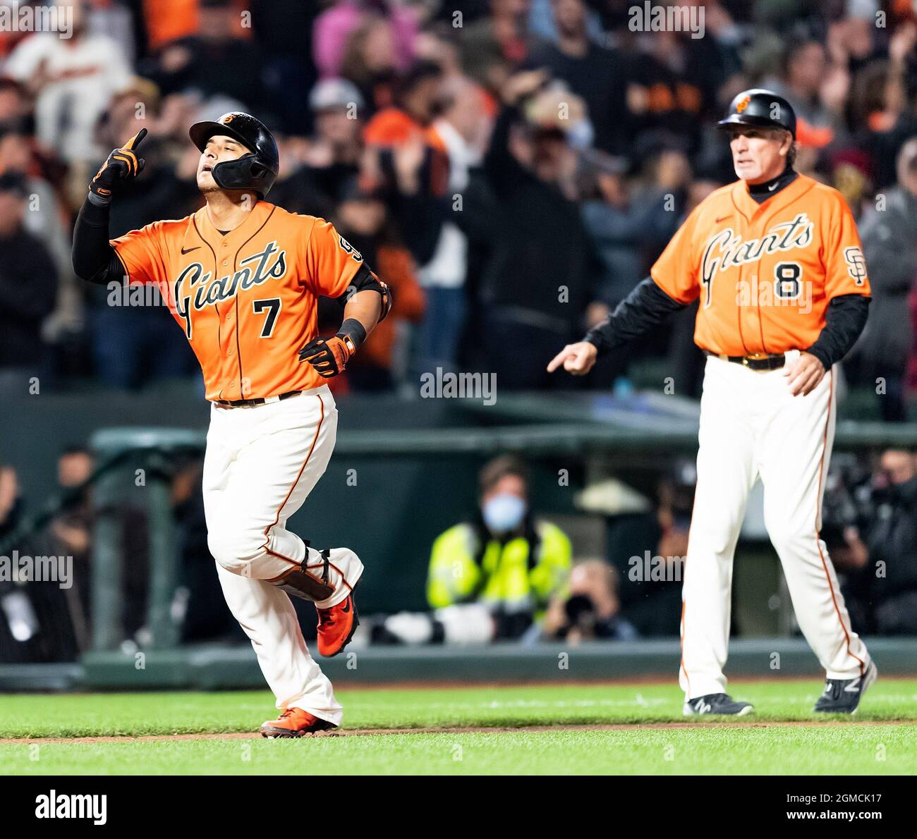San Francisco, California, USA. 17th Sep, 2021. SF Giants pinchitter Donovan  Solano (7) jogs past San Francisco Giants third base coach Ron Wotus (8)  celebrating his solo home run to tie the