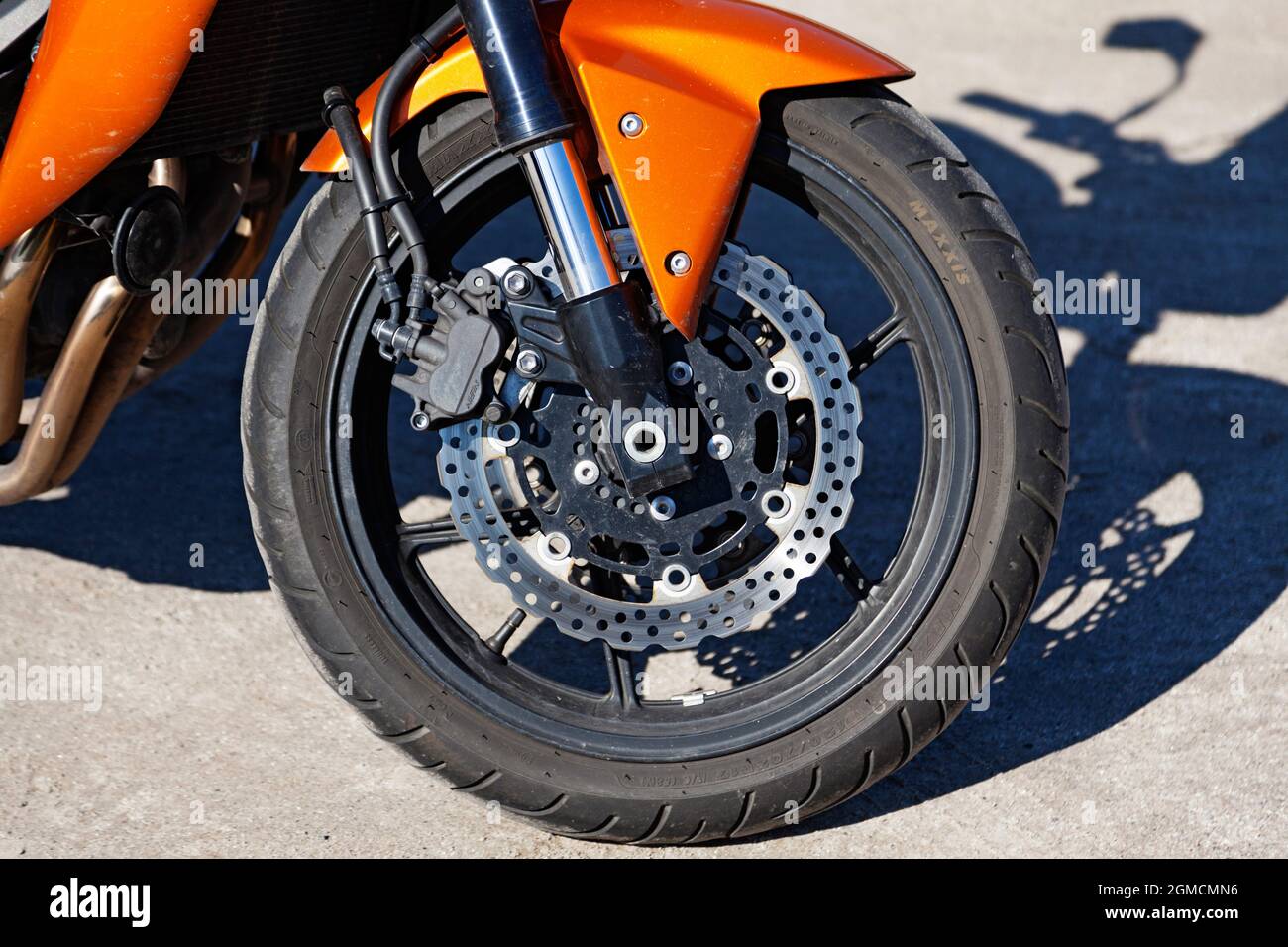 Umea, Norrland Sweden - May 21, 2020: the front wheel of an orange motorcycle Stock Photo