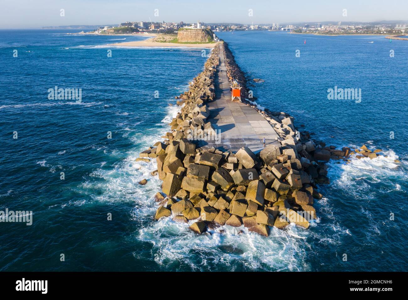 Aerial view of Nobbys breakwall at the mouth of the hunter river and Port of Newcastle - NSW Australia Stock Photo