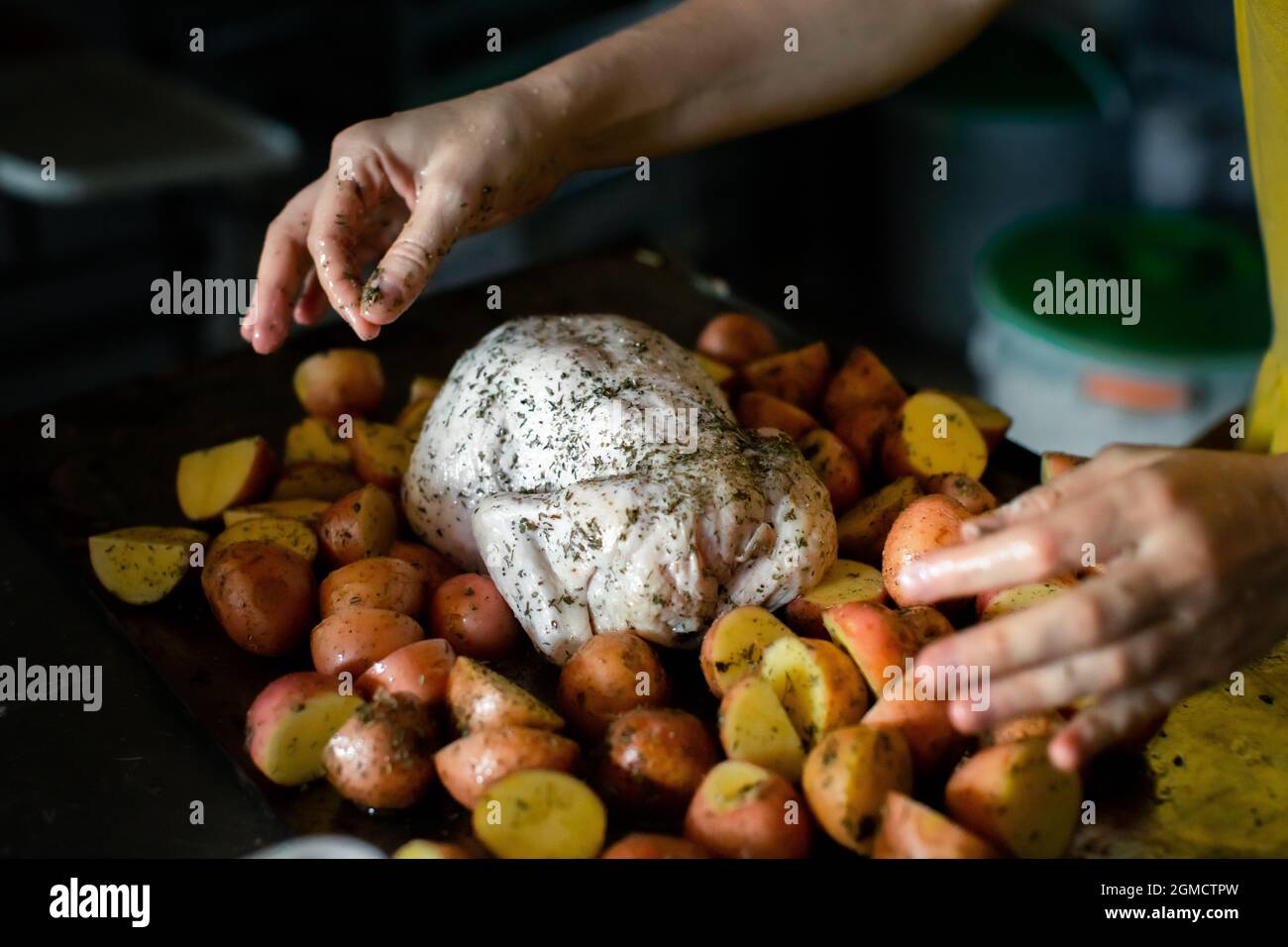 Cooking chicken baked with potatoes Stock Photo