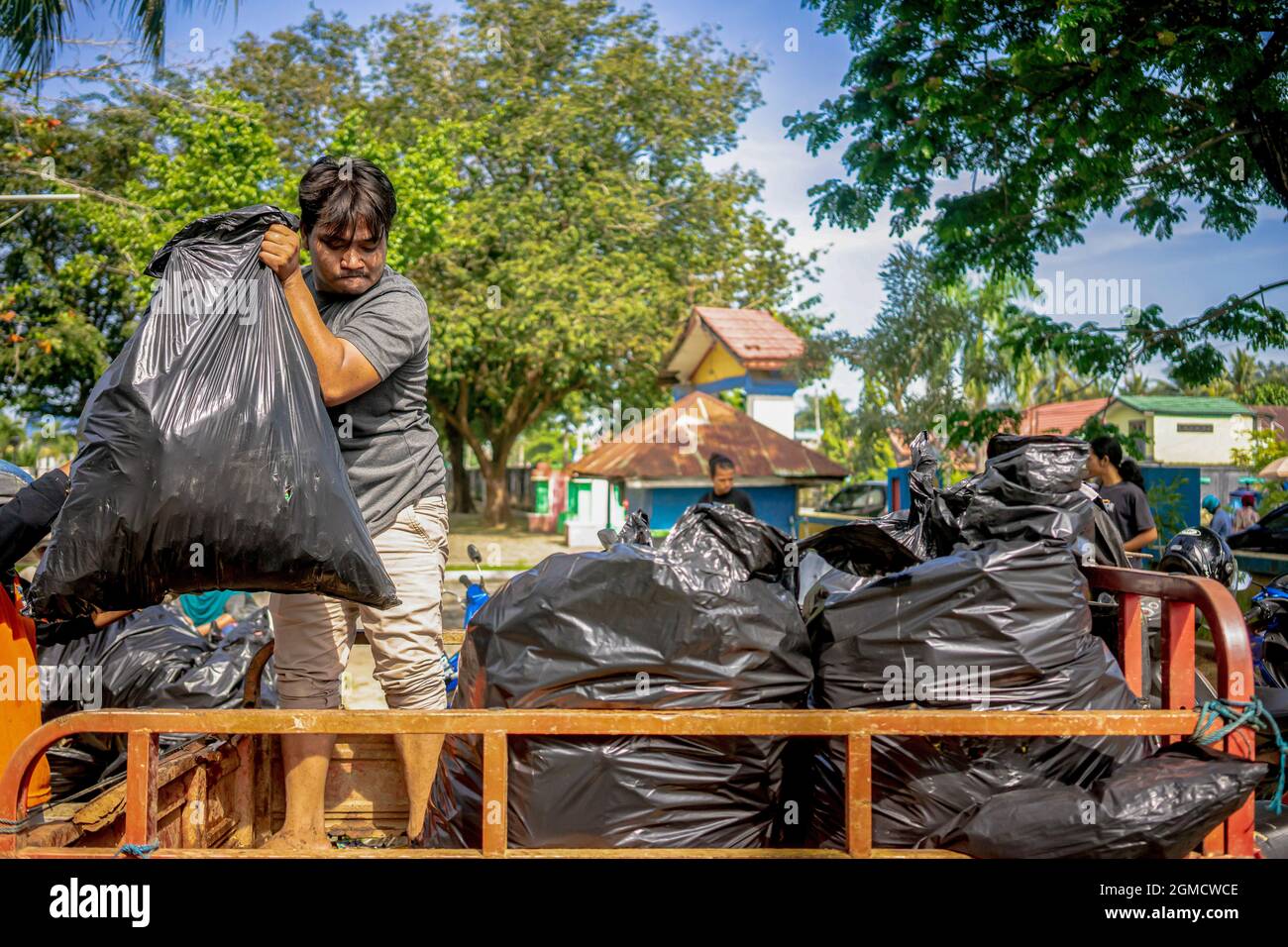 Kendari, Indonesia. 18th Sep, 2021. A Garbage Collector Disposes A Bin ...