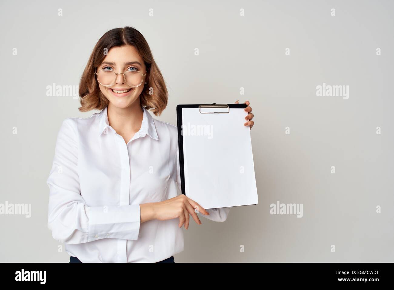 Business woman in white shirt with documents in hands emotion work ...