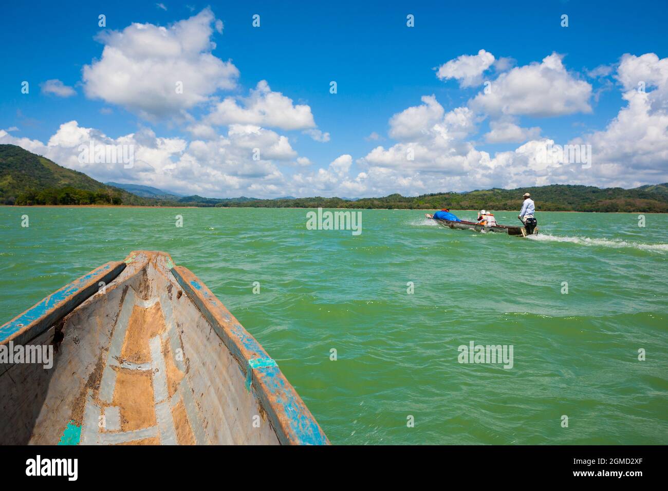 Two dugout canoes with travellers are crossing Alajuela lake, Panama province, Republic of Panama, Central America. Stock Photo