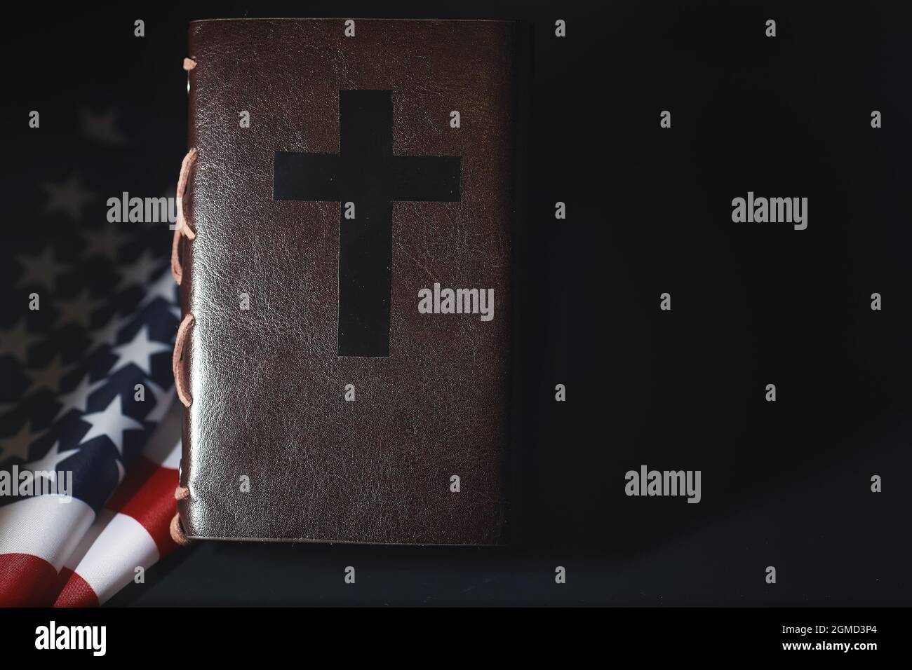 American flag and holy bible book on mirror background. Symbol of the ...