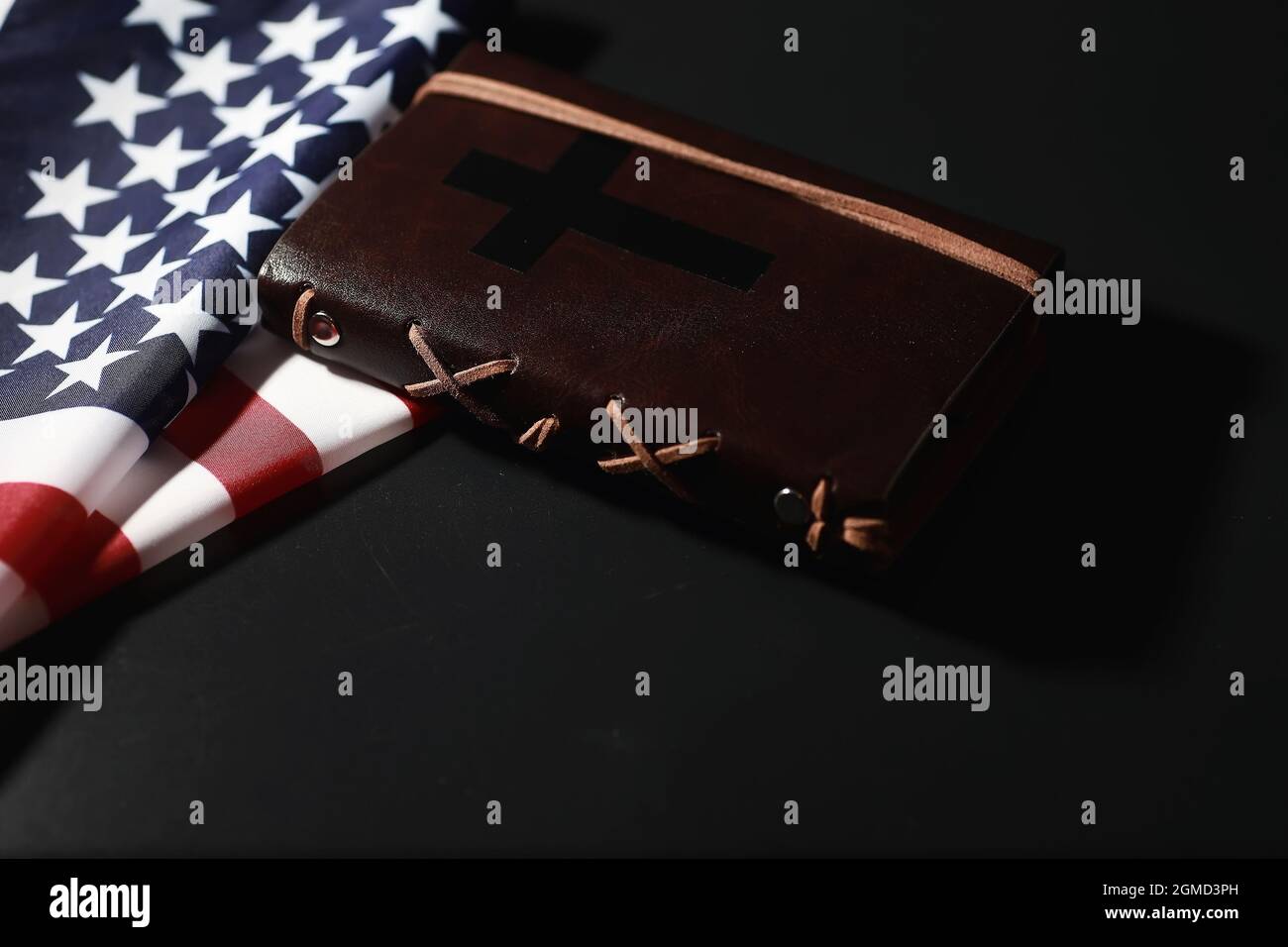 American flag and holy bible book on mirror background. Symbol of the ...