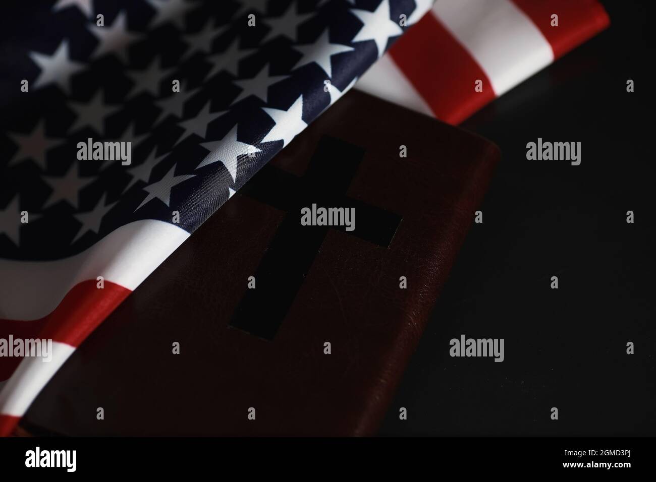 American flag and holy bible book on mirror background. Symbol of the ...
