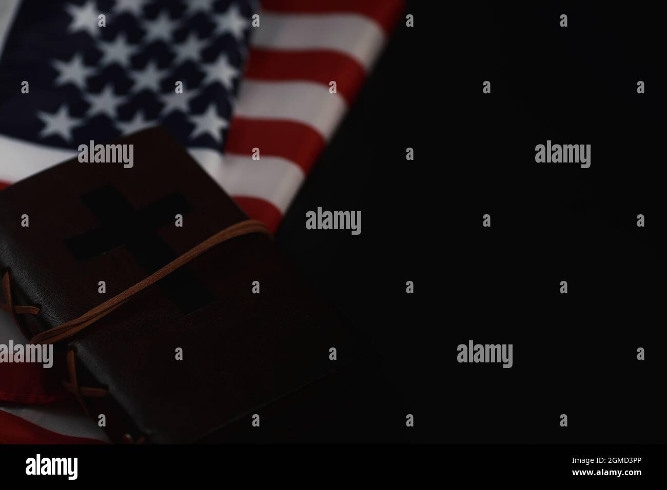 American flag and holy bible book on mirror background. Symbol of the ...