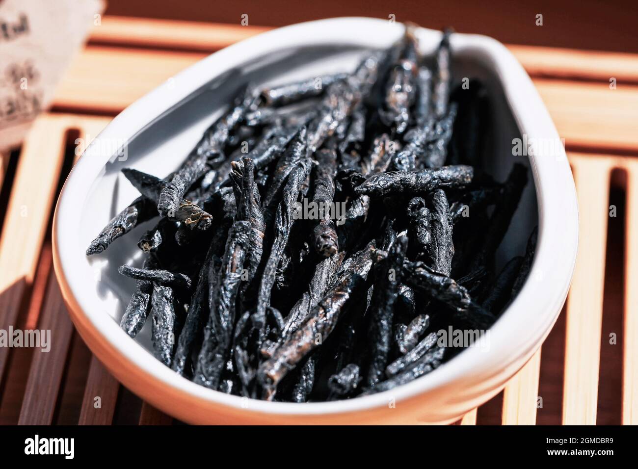 Kuding Chinese tea drink Kuding or kuzding in tea presentation vessel, macro ...