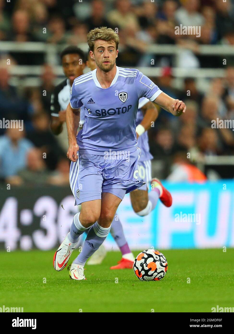 NEWCASTLE UPON TYNE, ENGLAND - SEPTEMBER 17: Patrick Bamford of Leeds United brings the ball forward during the Premier League match between Newcastle United and Leeds United at St. James Park on September 17, 2021 in Newcastle upon Tyne, England. (Photo by MB Media) Stock Photo
