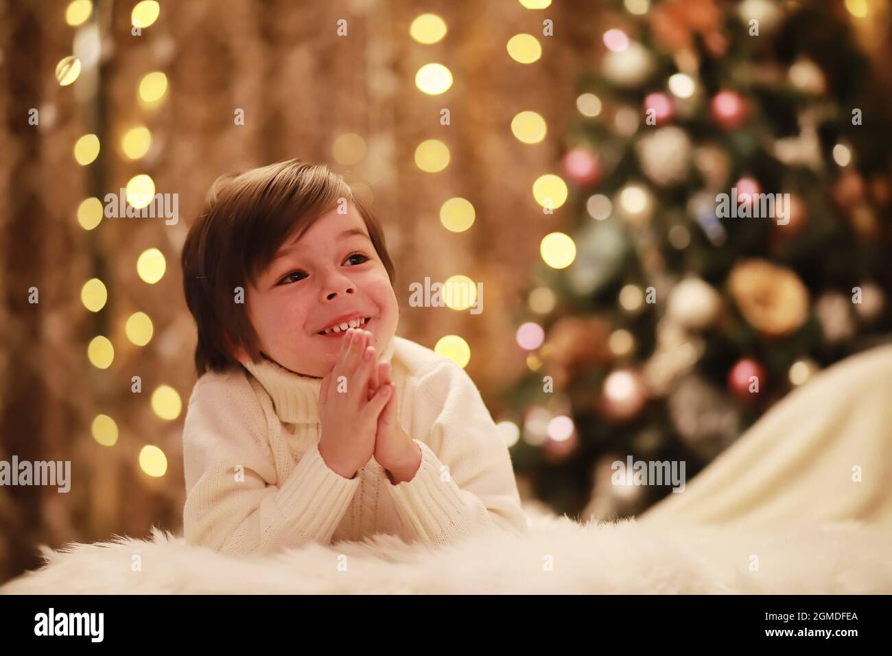 Family on Christmas eve at fireplace. Kids opening Xmas presents Christmas Eve Traditiona