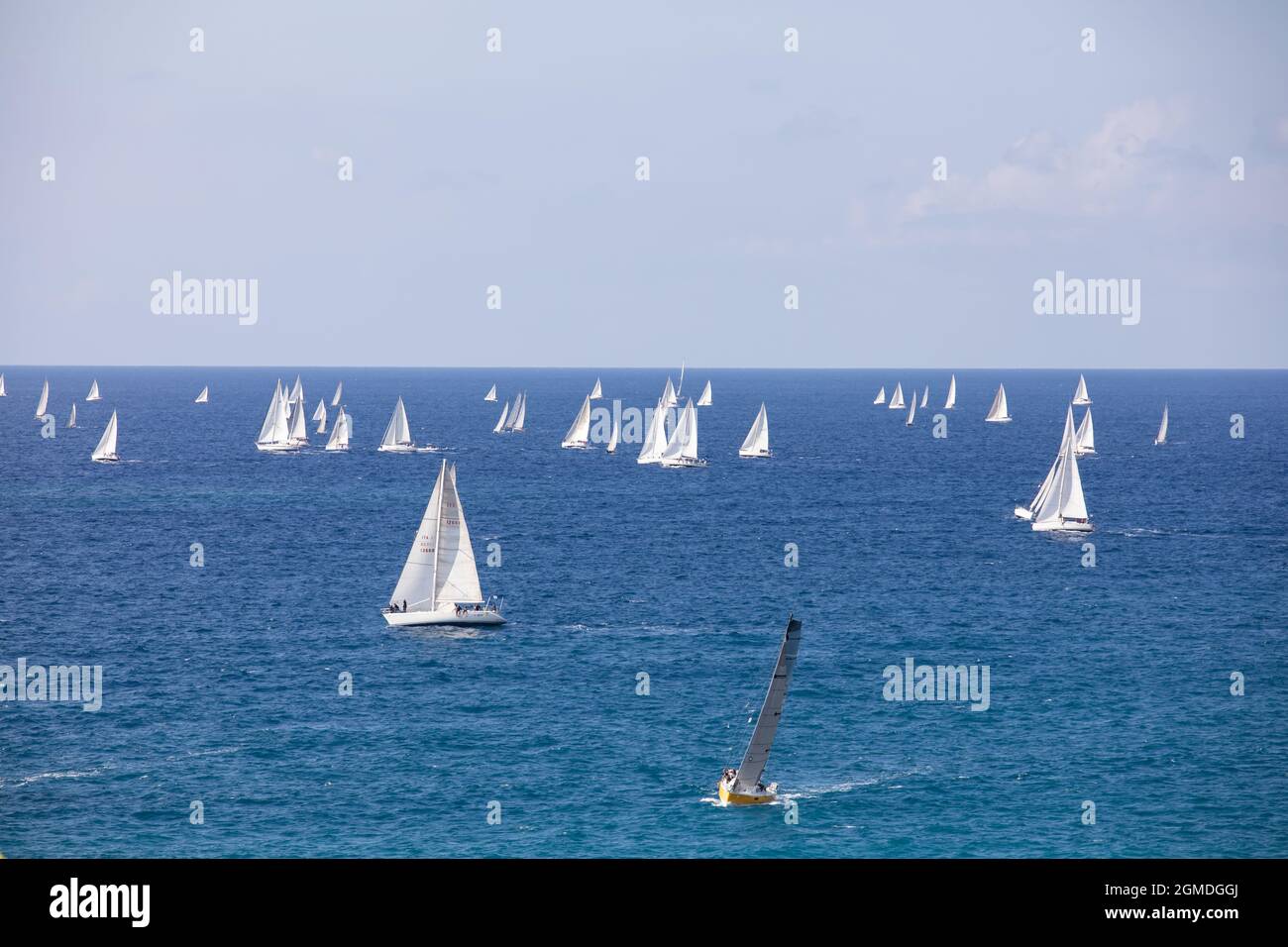 Sailing boats off the coast of Genoa after the departure of Millevele 2021 regatta Stock Photo