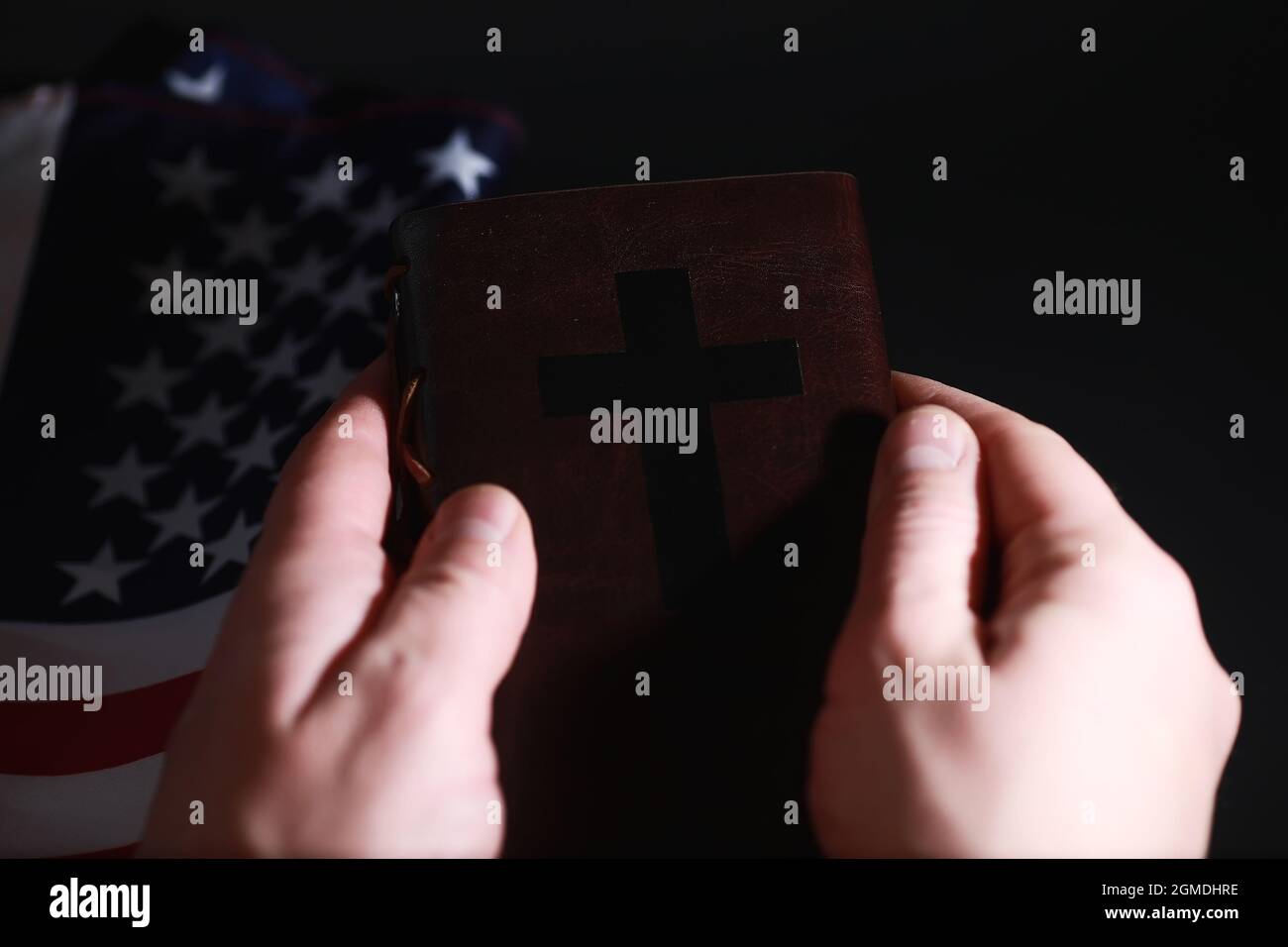 American flag and holy bible book on mirror background. Symbol of the ...