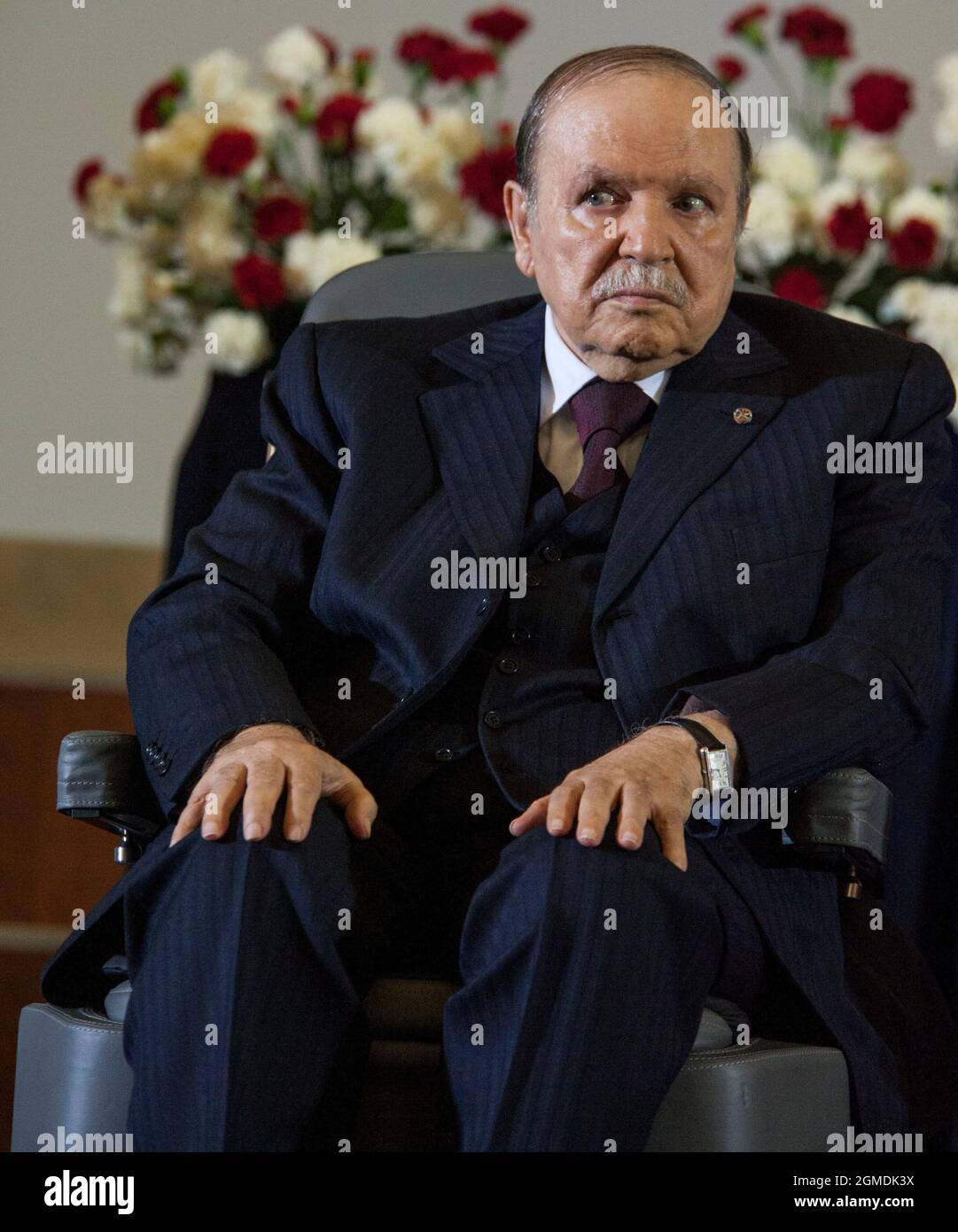 Algerian President Abdulaziz Bouteflika sits in his wheelchair on stage  during his inauguration ceremony as he is sworn as Algeria's President for  a fourth term in Algiers, Algeria, on April 28, 2014.
