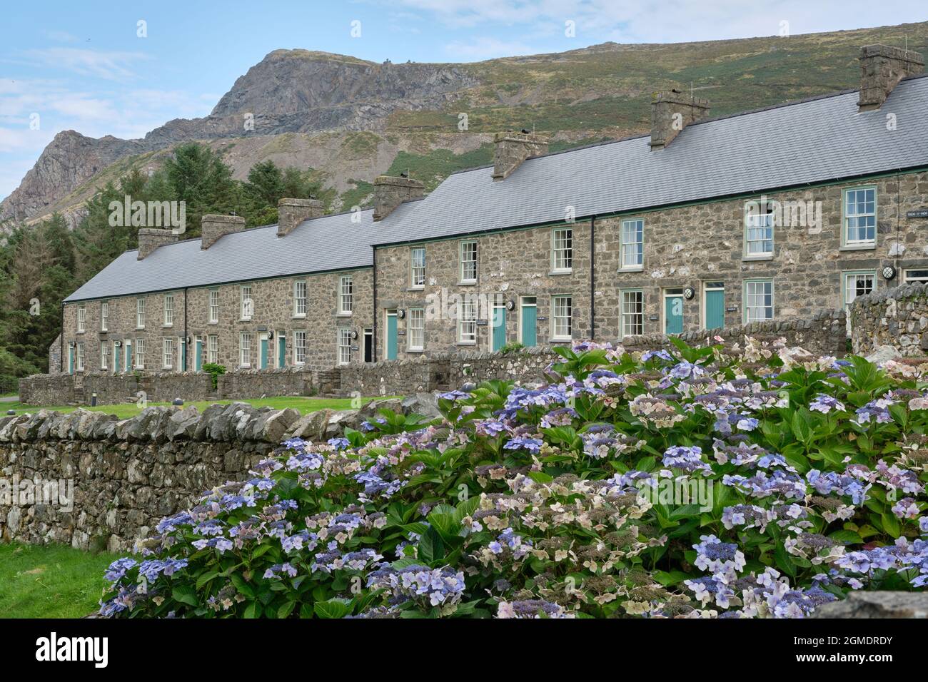 Former quarrymen's cottages have been redeveloped into a Welsh Language and Heritage Centre at Nant Gwrtheyrn on the Lleyn Peninsula Stock Photo