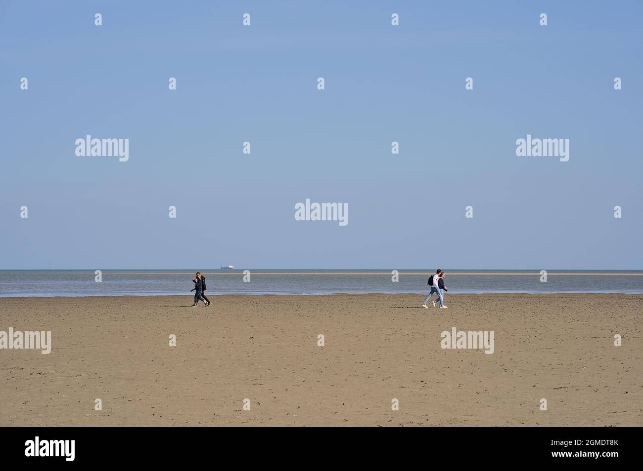 Beautiful bright view of Sandymount Beach, Dublin, Ireland. Walking people. Open spaces. High resolution Stock Photo