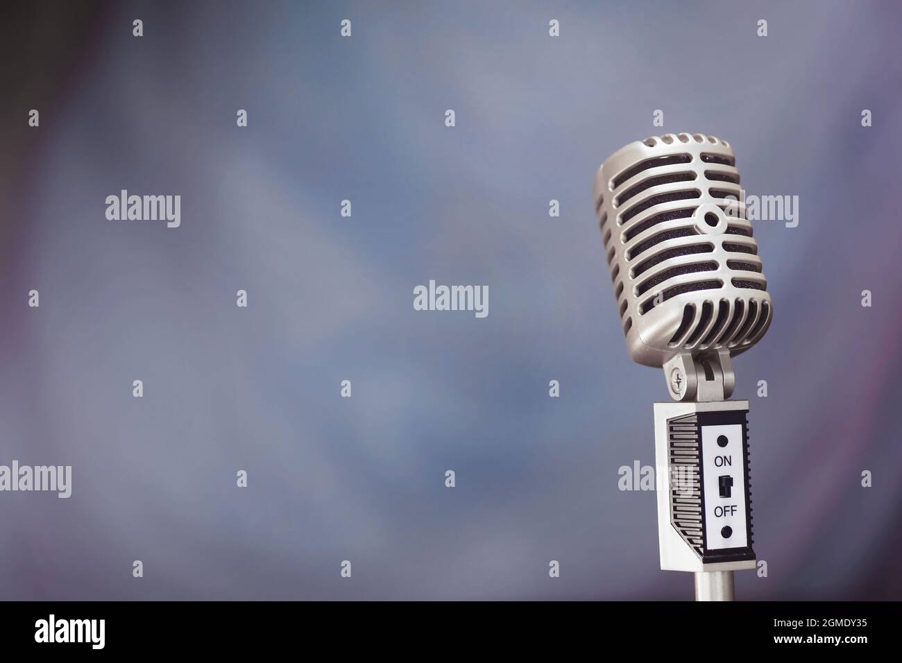 Stand with a retro microphone. Microphone on a tripod. Performance of