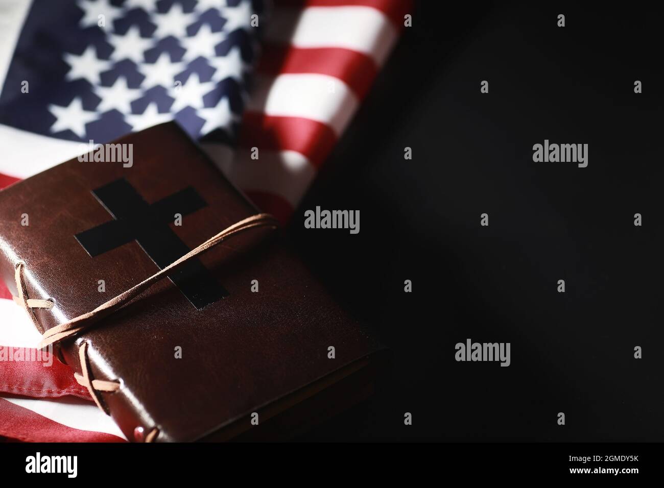 American flag and holy bible book on mirror background. Symbol of the ...