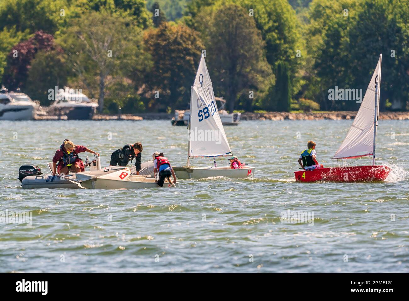 The sail training foundation holds youth sail training classes Fridays from May through October, in the channel between Lake Michigan and Green Bay. Stock Photo