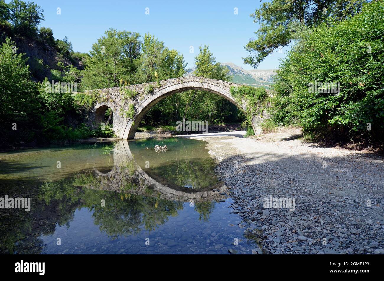 Greece, ancient stone bridge Kamber Aga aka Kamper Aga crossing Zagoritikos river Stock Photo